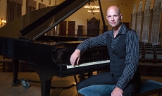 on stage at the piano